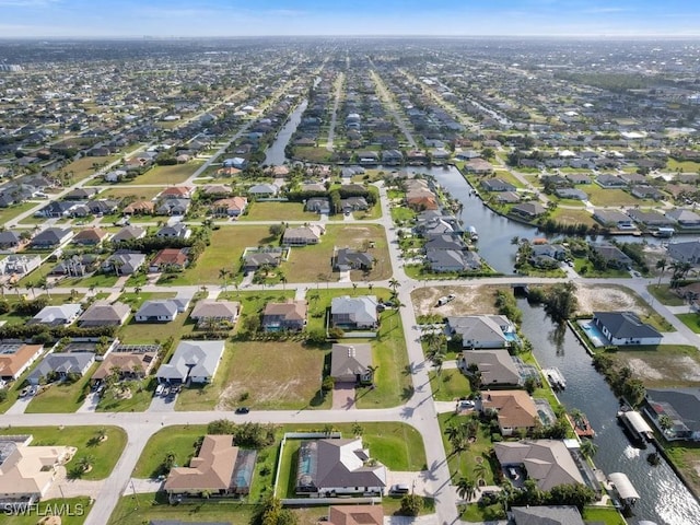 2911 SW 25th Pl, Cape Coral, FL 33914 - aerial view of property and surrounding area featuring nearby suburban area and a nearby body of water