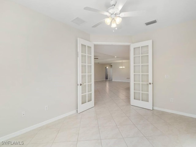 2911 SW 25th Pl, Cape Coral, FL 33914 - unfurnished room with french doors, a ceiling fan, baseboards, and light tile patterned flooring