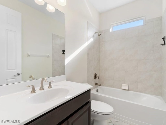 2911 SW 25th Pl, Cape Coral, FL 33914 - full bath featuring washtub / shower combination, toilet, vanity, and tile patterned floors