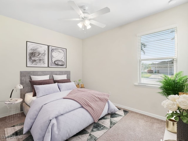 2911 SW 25th Pl, Cape Coral, FL 33914 - carpeted bedroom with baseboards and a ceiling fan