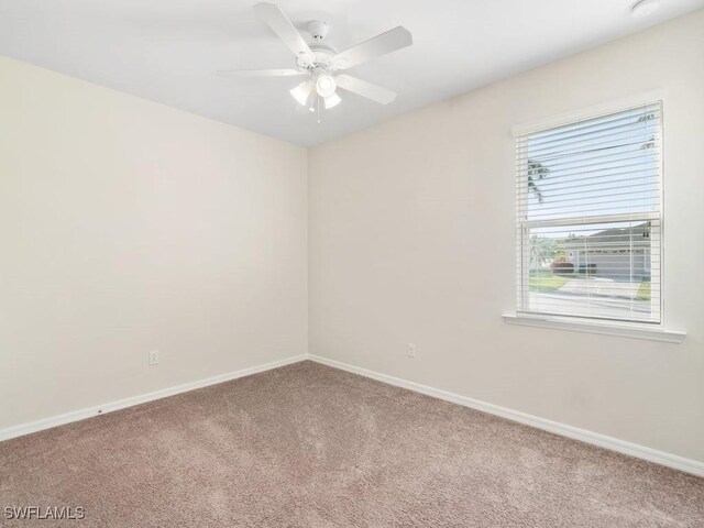 2911 SW 25th Pl, Cape Coral, FL 33914 - carpeted spare room featuring baseboards and a ceiling fan