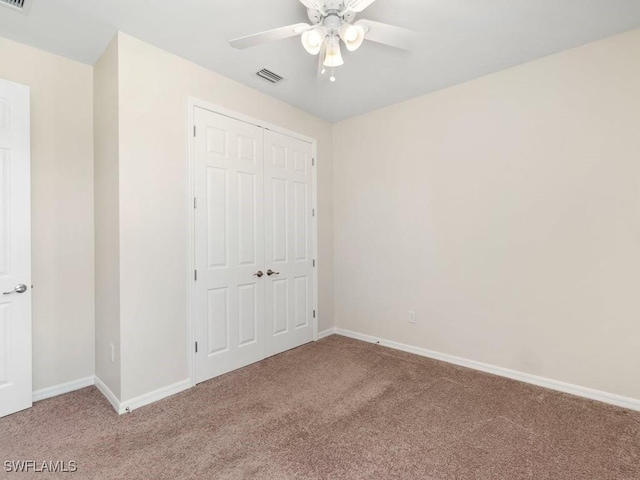 2911 SW 25th Pl, Cape Coral, FL 33914 - unfurnished bedroom with light colored carpet, a closet, and baseboards