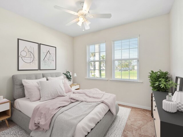 2911 SW 25th Pl, Cape Coral, FL 33914 - bedroom with baseboards, carpet, and a ceiling fan