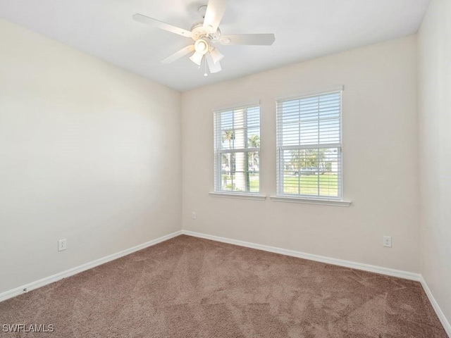 2911 SW 25th Pl, Cape Coral, FL 33914 - carpeted spare room with baseboards and ceiling fan