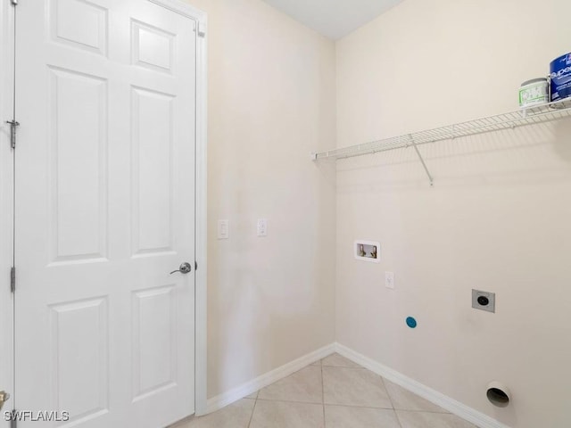 2911 SW 25th Pl, Cape Coral, FL 33914 - clothes washing area featuring hookup for an electric dryer, washer hookup, baseboards, and light tile patterned floors