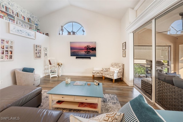 5858 Westbourgh Ct, Naples, FL 34112 - living area with dark wood-style floors, high vaulted ceiling, and baseboards