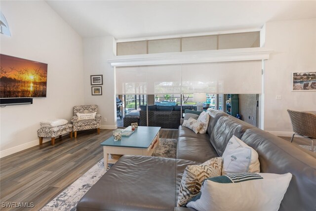 5858 Westbourgh Ct, Naples, FL 34112 - living room featuring dark wood-style floors and baseboards