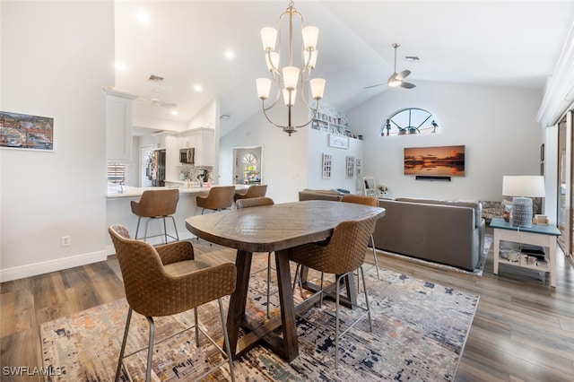 5858 Westbourgh Ct, Naples, FL 34112 - dining area featuring high vaulted ceiling, dark wood-style flooring, visible vents, and baseboards