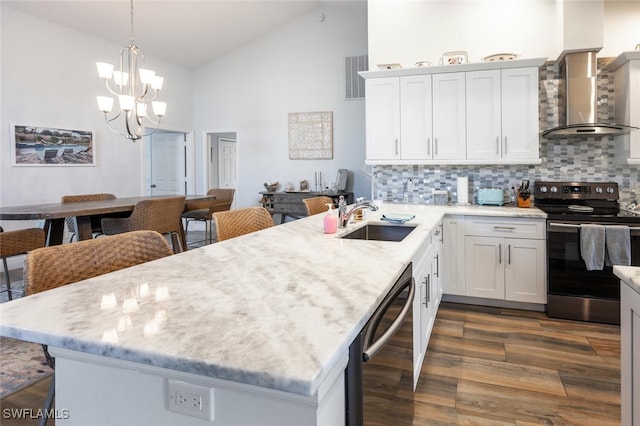 5858 Westbourgh Ct, Naples, FL 34112 - kitchen with a sink, white cabinetry, electric stove, wall chimney range hood, and dishwasher