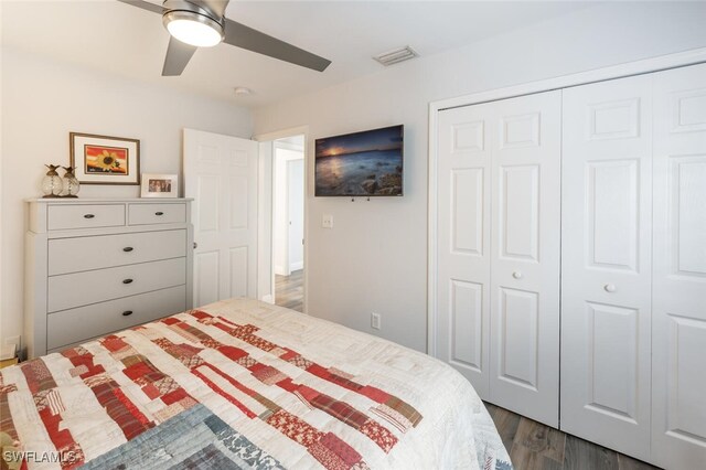 5858 Westbourgh Ct, Naples, FL 34112 - bedroom featuring dark wood-style flooring, a closet, visible vents, and a ceiling fan