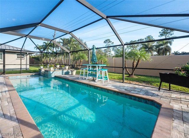 5858 Westbourgh Ct, Naples, FL 34112 - view of swimming pool featuring glass enclosure, a fenced backyard, a patio area, and a pool with connected hot tub