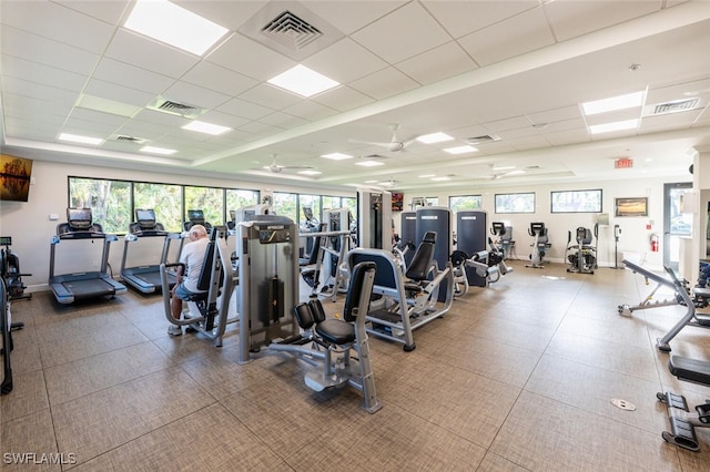 5858 Westbourgh Ct, Naples, FL 34112 - workout area featuring a paneled ceiling, visible vents, and baseboards