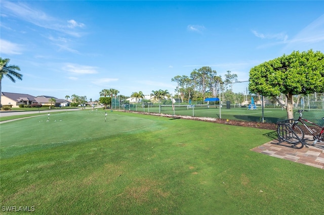 5858 Westbourgh Ct, Naples, FL 34112 - surrounding community with a tennis court and fence