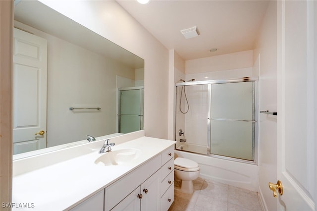 full bath with visible vents, toilet, enclosed tub / shower combo, tile patterned floors, and vanity