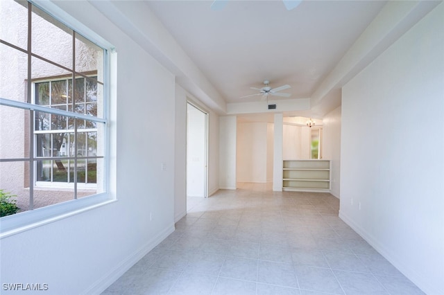 corridor featuring light tile patterned floors, visible vents, stairway, and baseboards