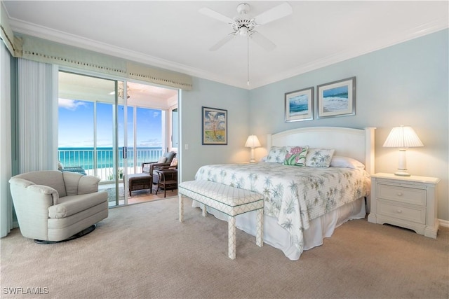 bedroom with access to exterior, a water view, crown molding, and light carpet