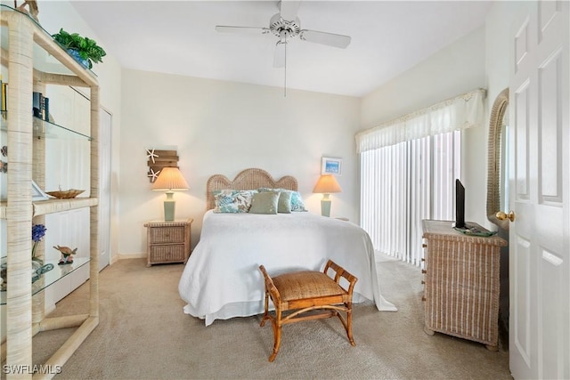 bedroom featuring light carpet and ceiling fan