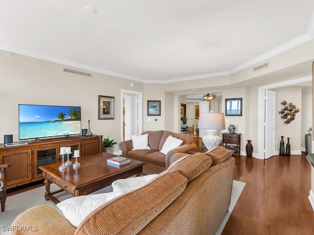 living room featuring ornamental molding and hardwood / wood-style floors