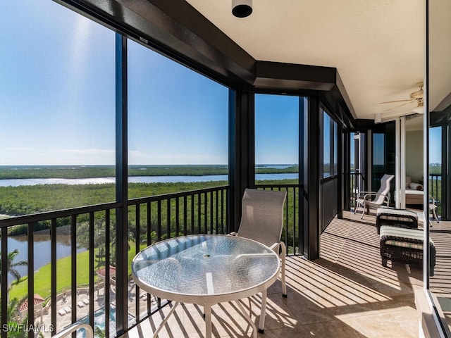 balcony featuring a water view