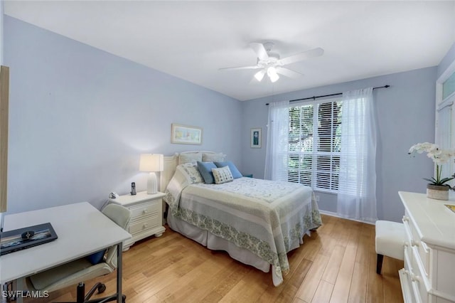 bedroom featuring light wood-style floors and ceiling fan