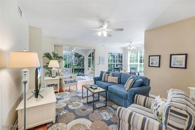 living room featuring wood finished floors and visible vents