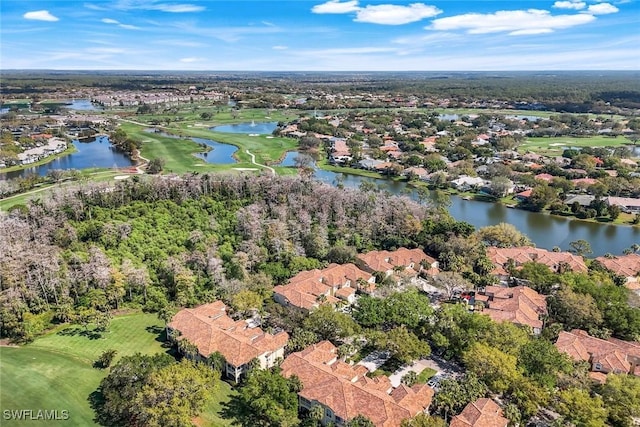 birds eye view of property featuring golf course view and a water view