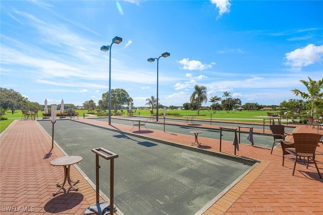 77 Silver Oaks Cir Unit 8-104, Naples, FL 34119 - view of property's community with a bocce ball area