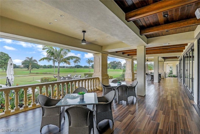 wooden terrace with outdoor dining area