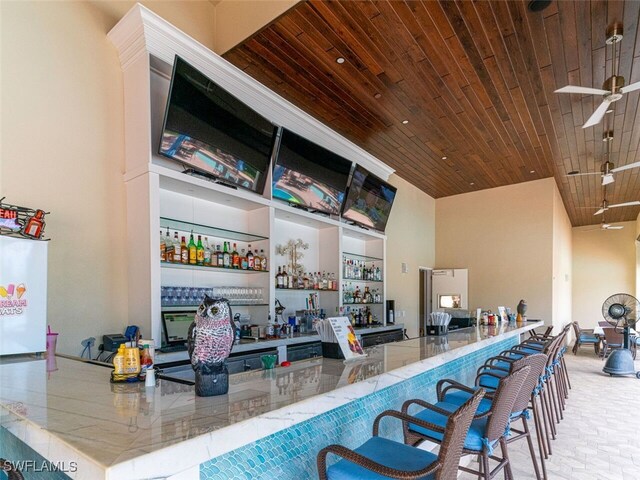 77 Silver Oaks Cir Unit 8-104, Naples, FL 34119 - community bar area featuring wooden ceiling and a high ceiling