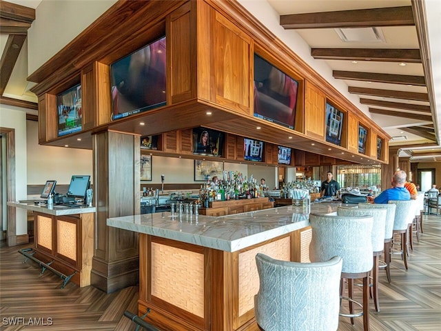 bar with beam ceiling and wet bar