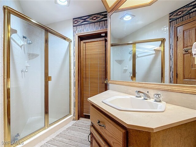 full bath with a stall shower, recessed lighting, and vanity