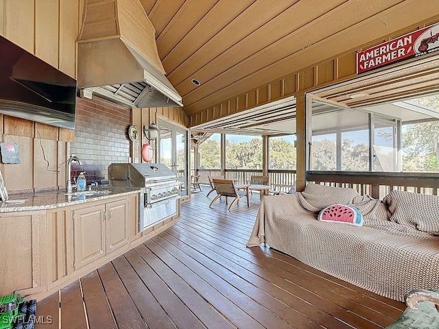 interior space featuring a sink, area for grilling, and a grill