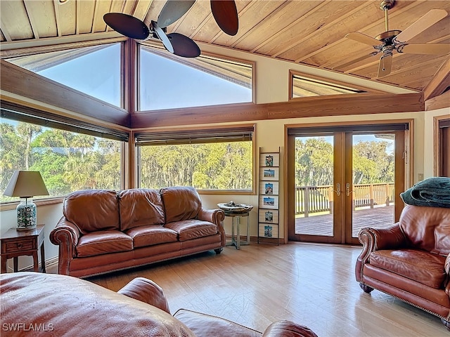 living area featuring ceiling fan, french doors, vaulted ceiling, and wooden ceiling
