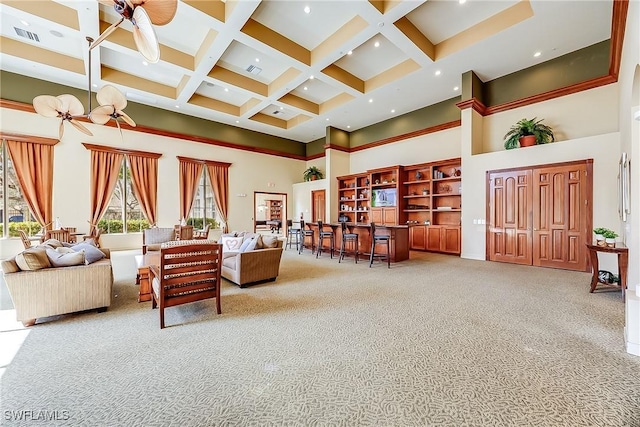 carpeted living room with beamed ceiling, visible vents, coffered ceiling, recessed lighting, and a towering ceiling