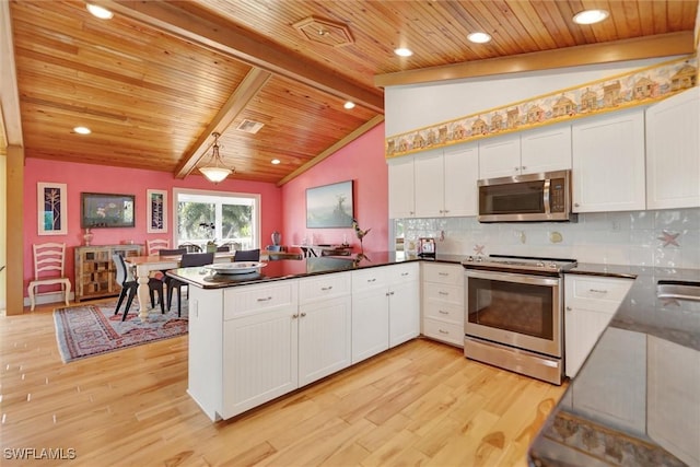 kitchen with appliances with stainless steel finishes, light hardwood / wood-style flooring, white cabinets, and kitchen peninsula