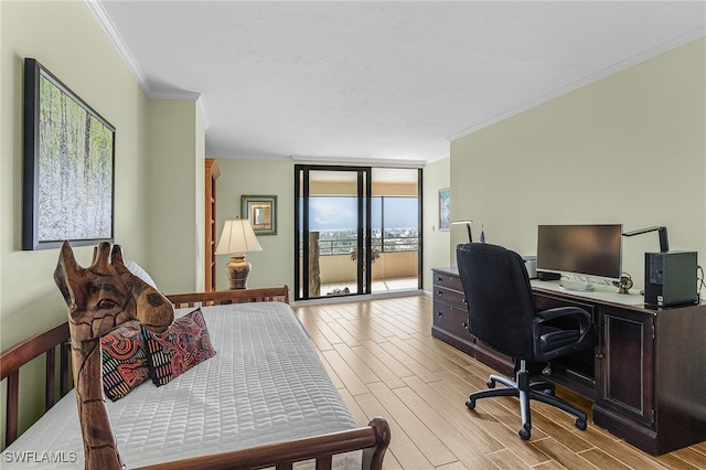 bedroom featuring light wood-type flooring, access to exterior, floor to ceiling windows, and ornamental molding