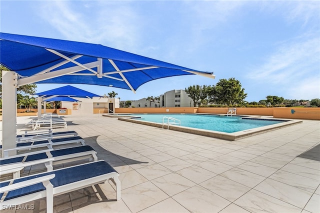 pool with a patio area