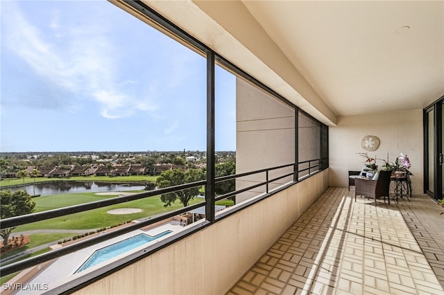 balcony featuring a water view