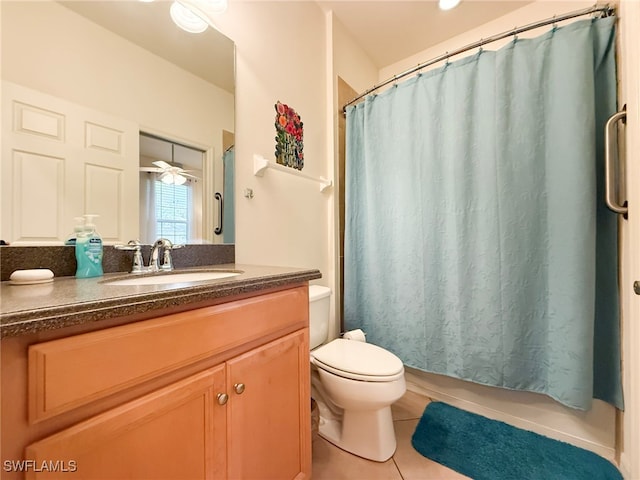 bathroom with curtained shower, vanity, toilet, and tile patterned floors