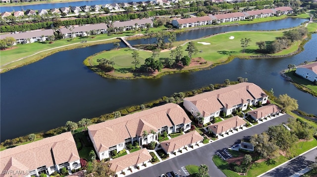 drone / aerial view featuring a residential view and a water view