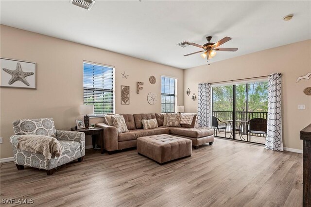 3791 Pino Vista Way Unit 201, Estero, FL 33928 - living room featuring ceiling fan, wood finished floors, and baseboards