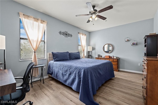 3791 Pino Vista Way Unit 201, Estero, FL 33928 - bedroom featuring light wood finished floors, baseboards, an office area, and a ceiling fan