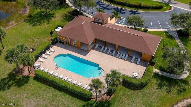 view of pool with fence and a patio