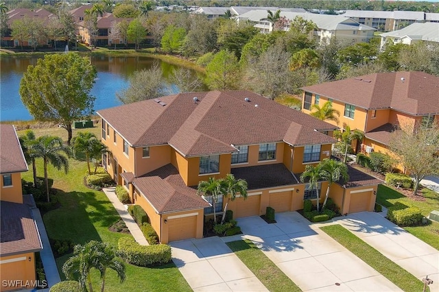 birds eye view of property featuring a water view and a residential view