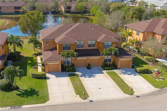 bird's eye view with a water view and a residential view