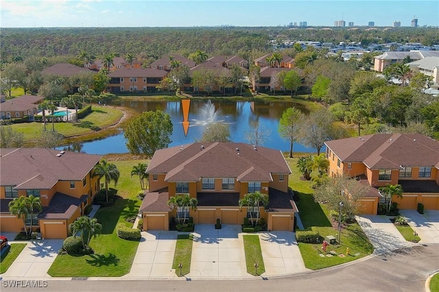 aerial view featuring a water view and a residential view