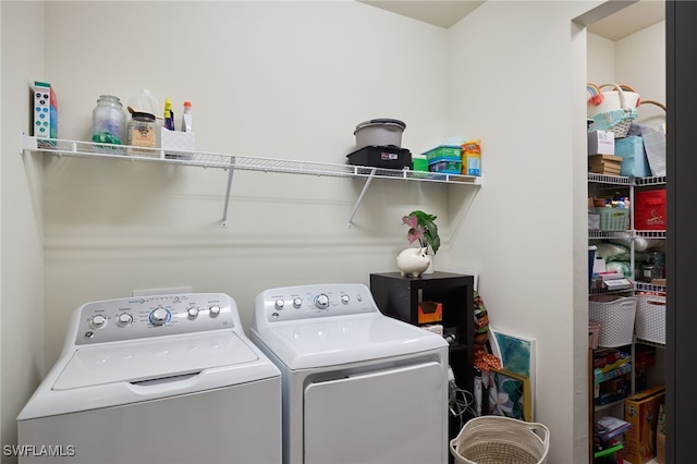 laundry area with washing machine and dryer and laundry area