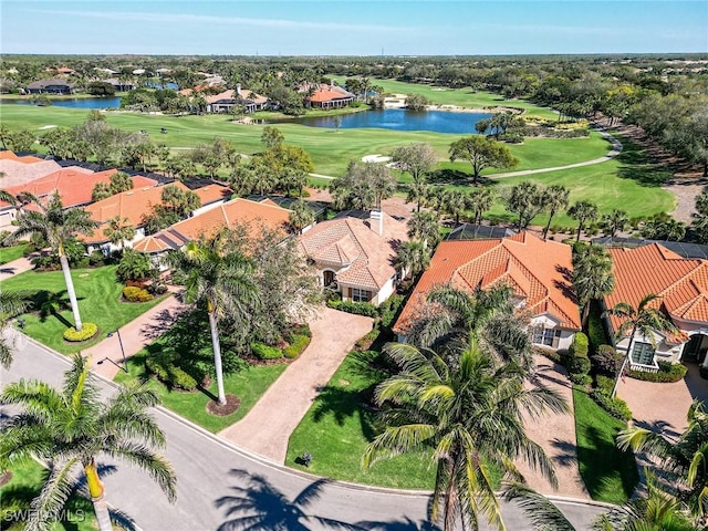 birds eye view of property with a residential view, view of golf course, and a water view