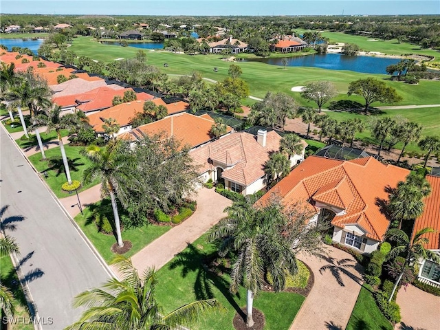 aerial view with view of golf course and a water view