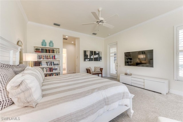 bedroom featuring a ceiling fan, crown molding, visible vents, and carpet flooring